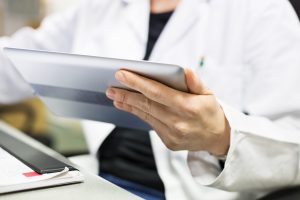 midsection-of-pharmacist-holding-digital-tablet-669896562_5760x3840-300x200